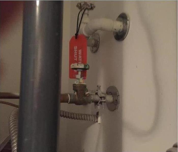 Pipes and a labeled shutoff valve 
