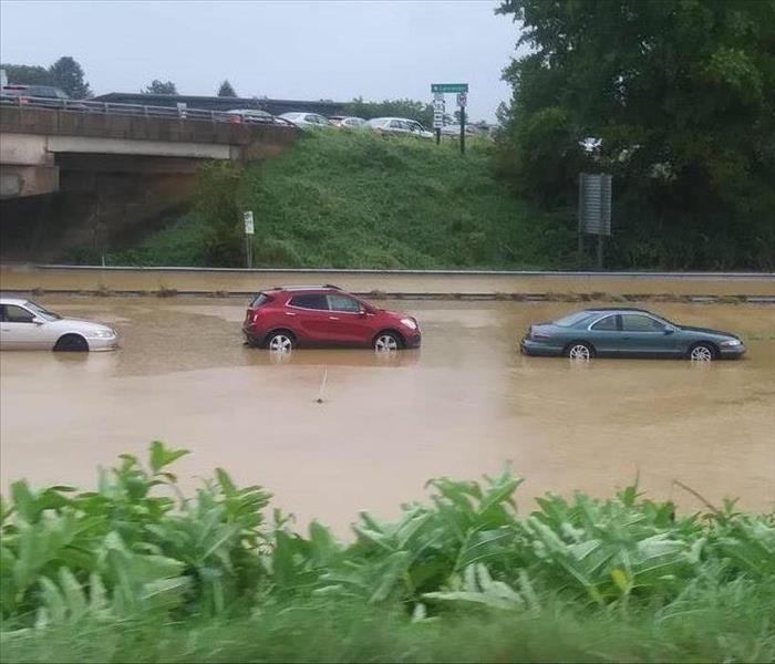 Cars submerged on a flooded highway