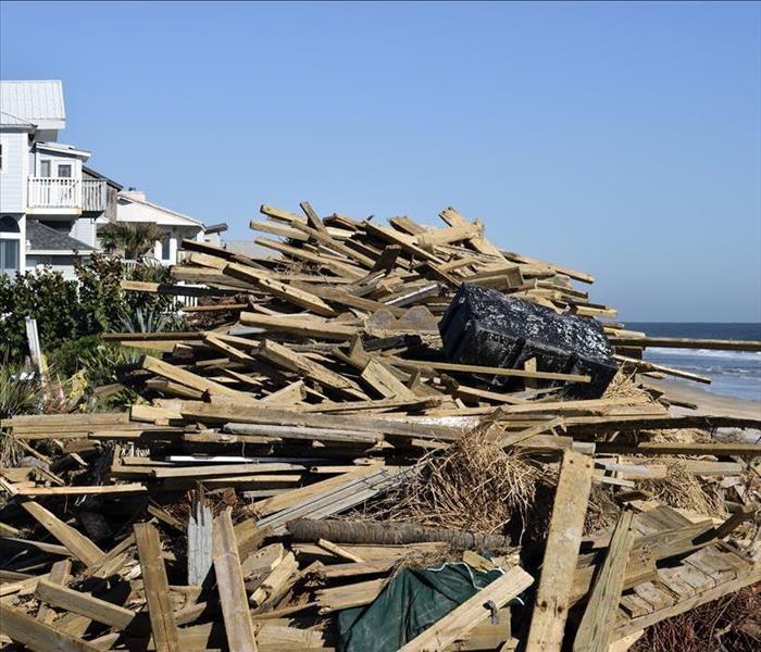A pile of wood and debris on the coast